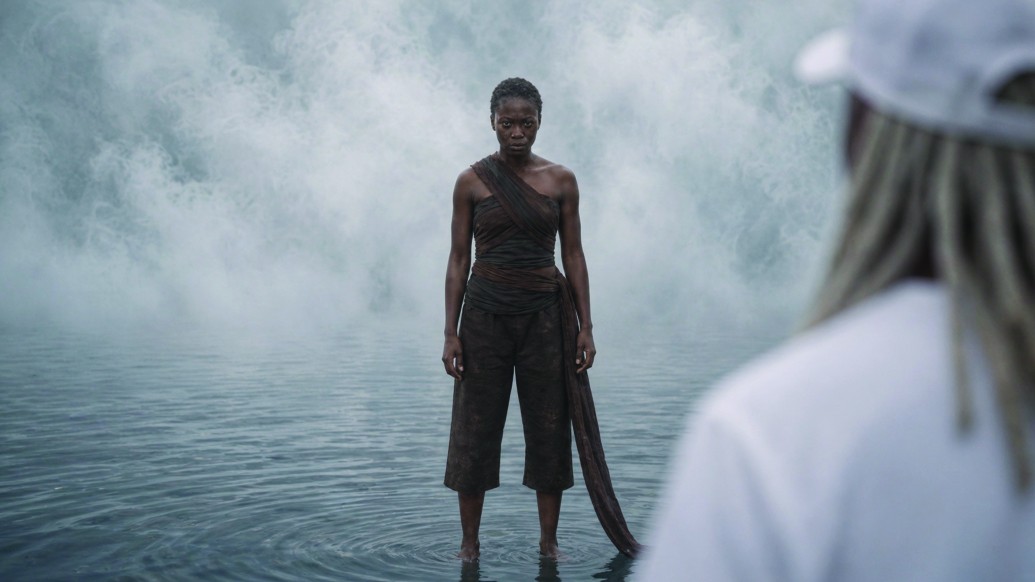 Nya Nyongo standing in misty lake water